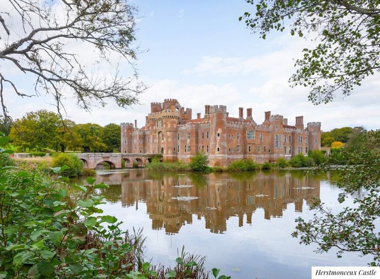 A grand brick-built castle, surrounded by a moat